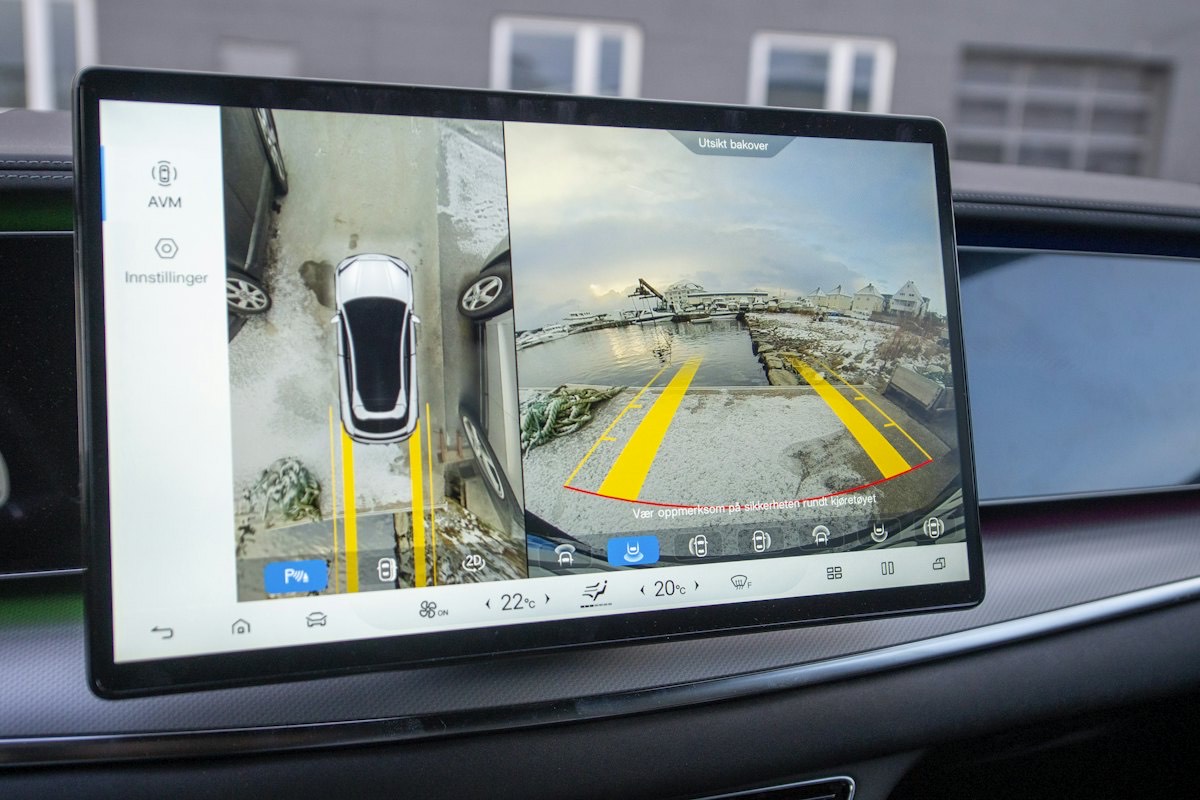 A dashboard screen showing a parking camera view with guide lines