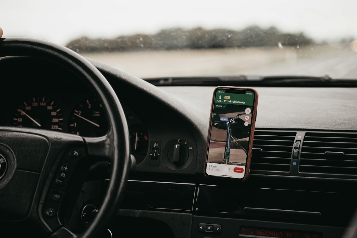 A phone mounted on a car dashboard